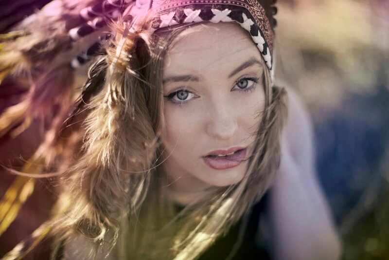 woman with feathered headband