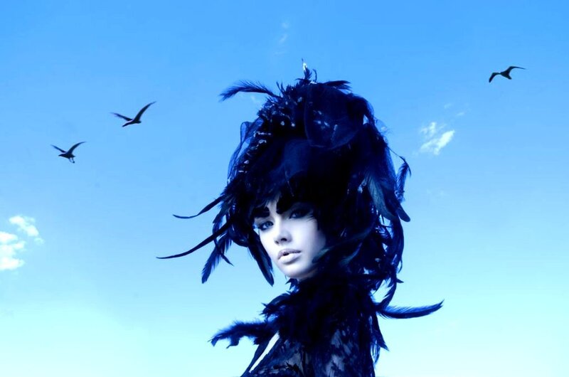 Woman with Feathered Headdress — Blue, Dramatic, Daytime