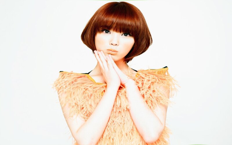 woman with feathered top