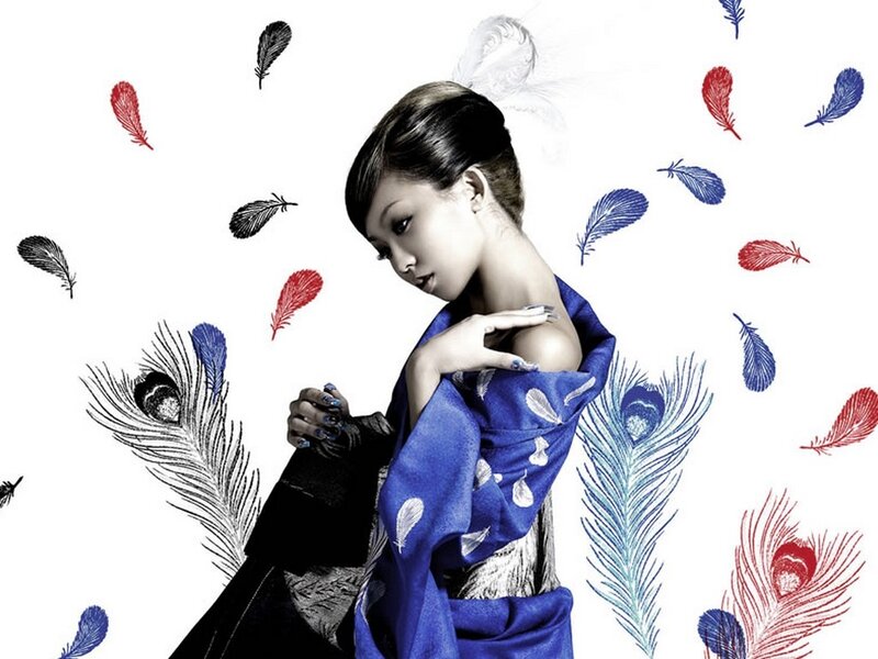 woman with feathers in blue kimono
