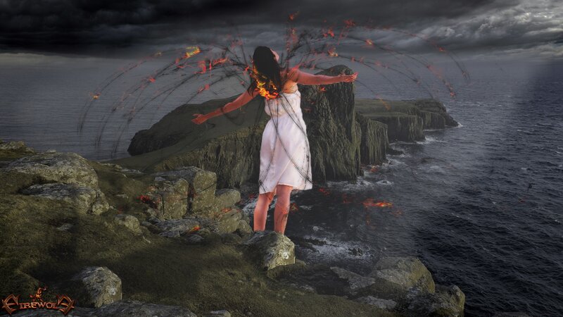 woman with fiery wings on cliff
