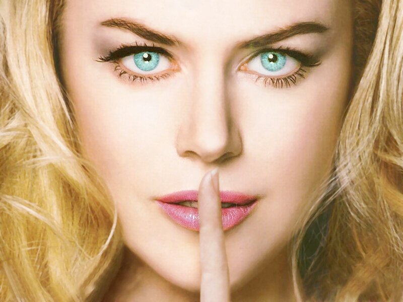 woman with finger on lips
