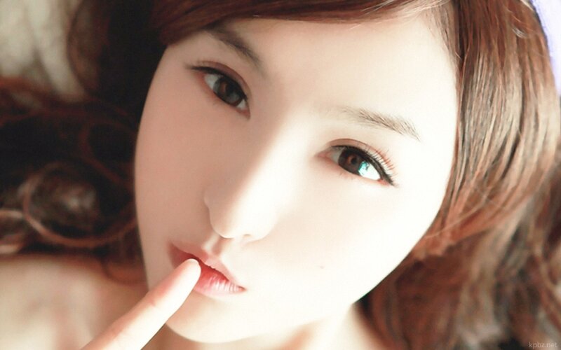 woman with finger on lips