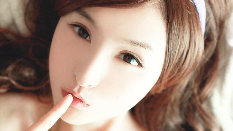 woman with finger on lips