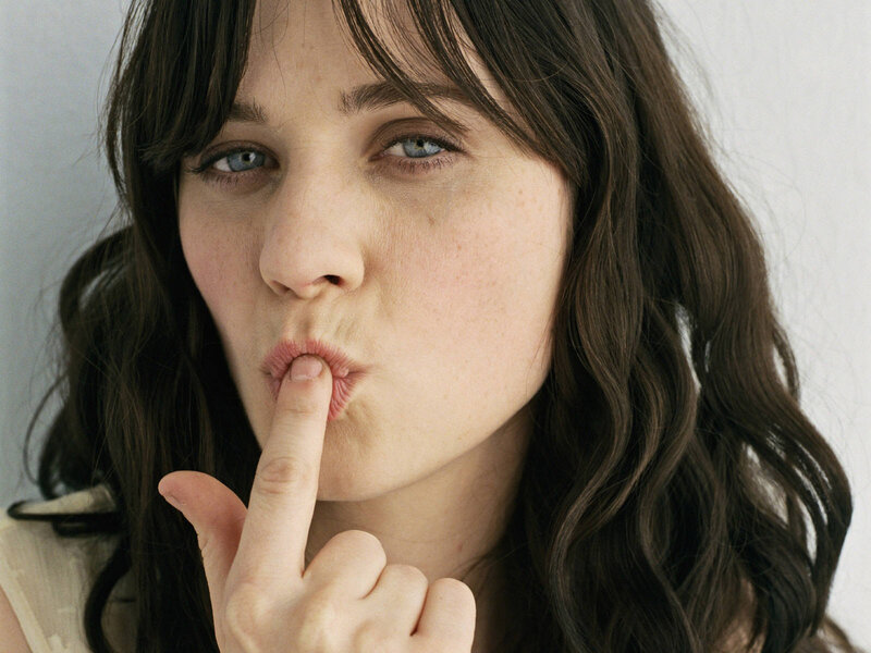woman with finger on lips
