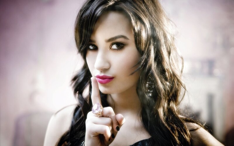 woman with finger to lips