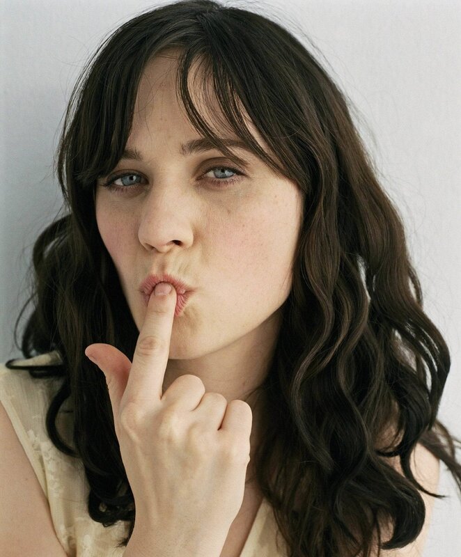 woman with finger to lips