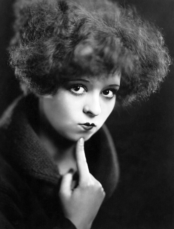 woman with finger to lips