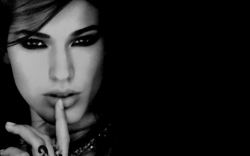 woman with finger to lips