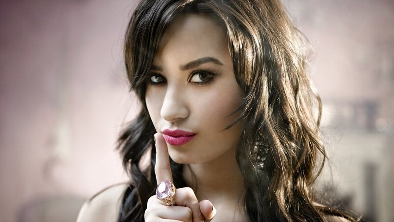 woman with finger to lips