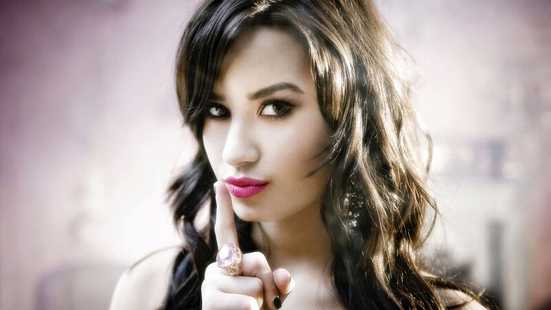 woman with finger to lips