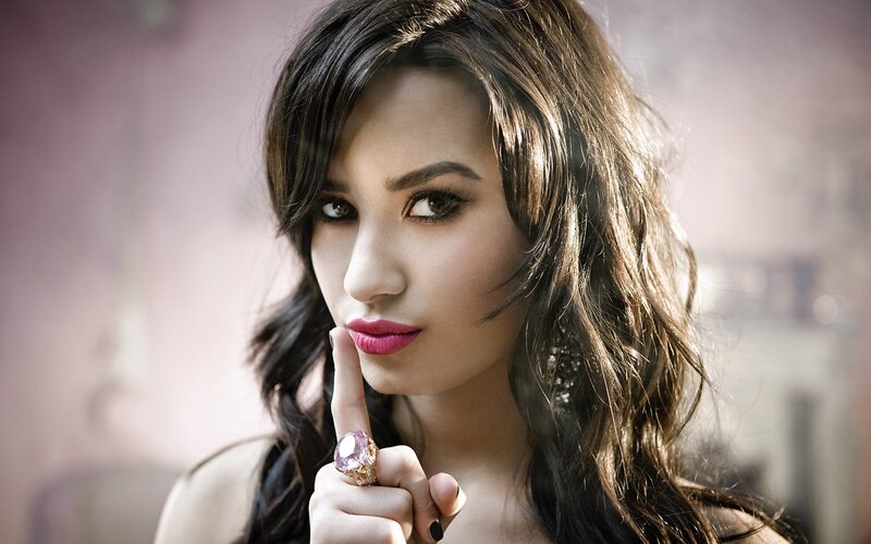 woman with finger to lips