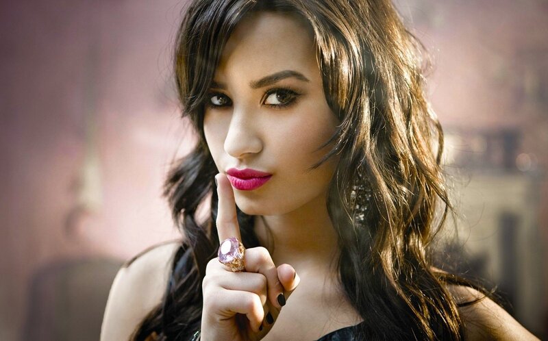 woman with finger to lips