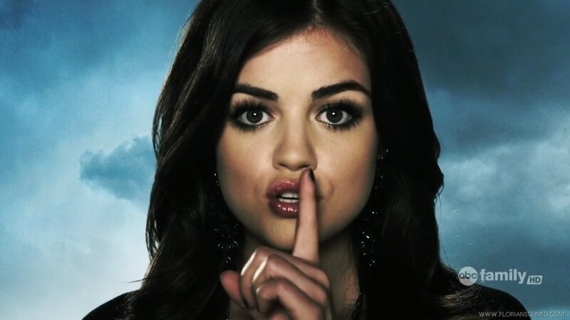 woman with finger to lips