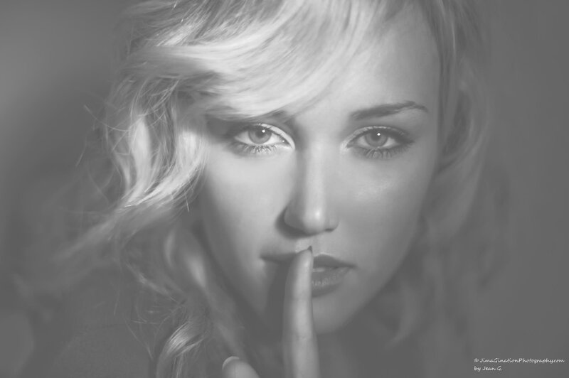woman with finger to lips