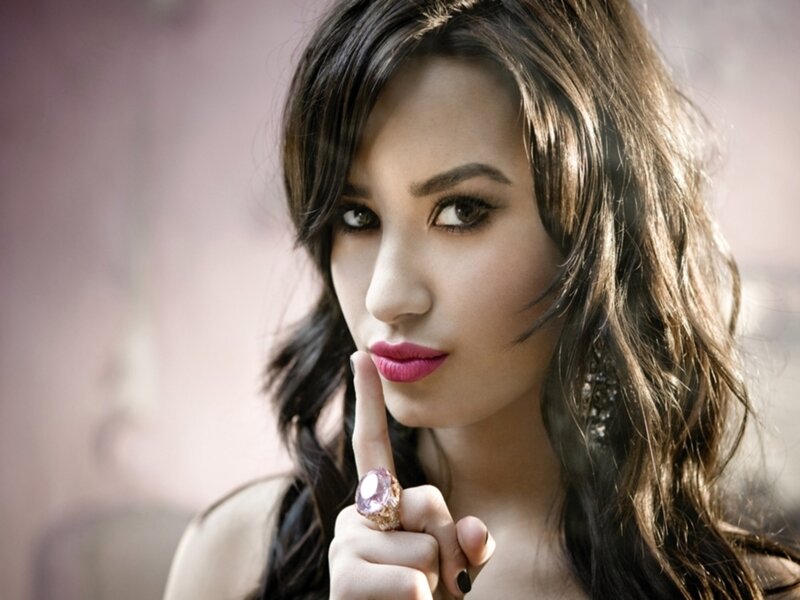 woman with finger to lips