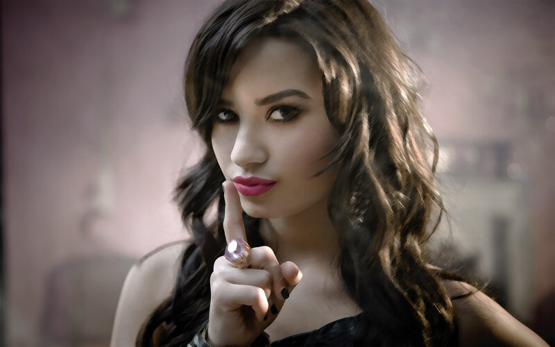woman with finger to lips