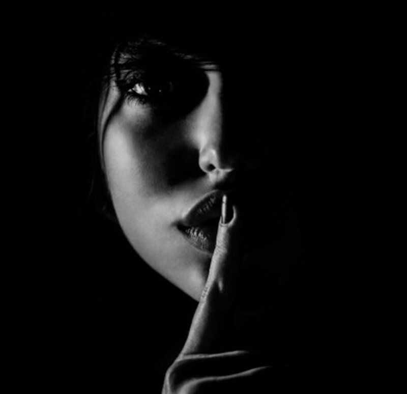 Woman with Finger to Lips — Black