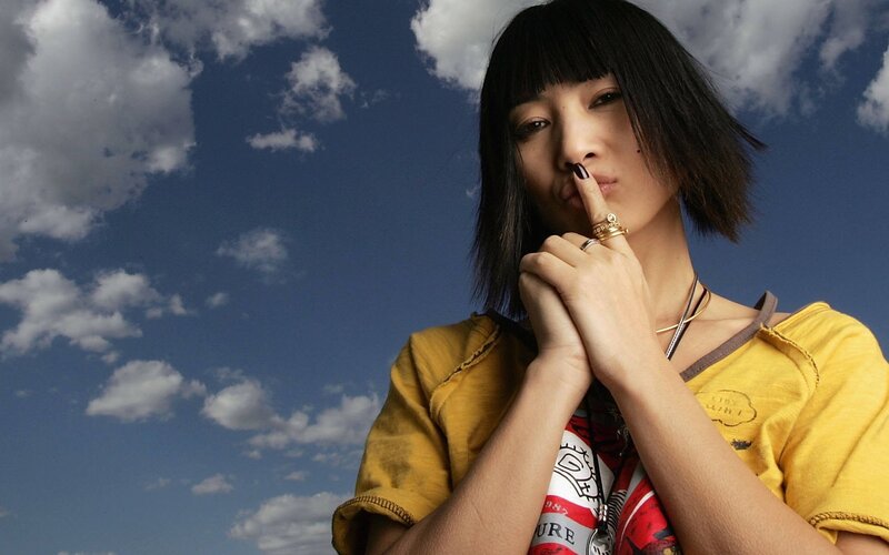 woman with finger to lips