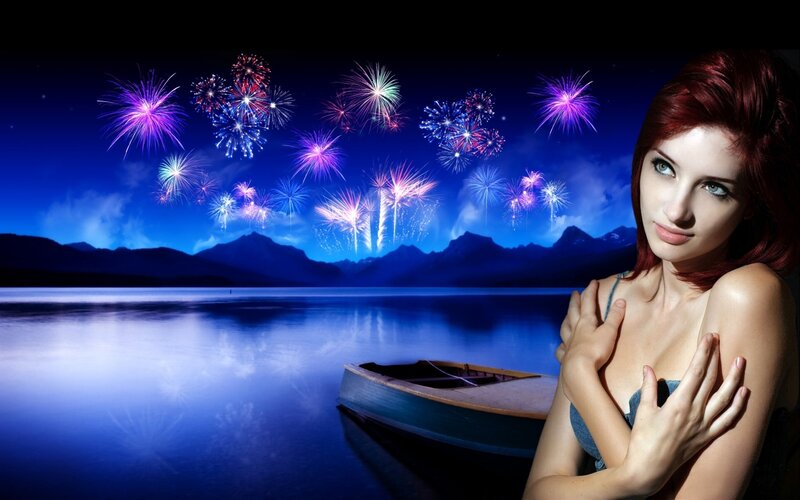Woman with fireworks over lake