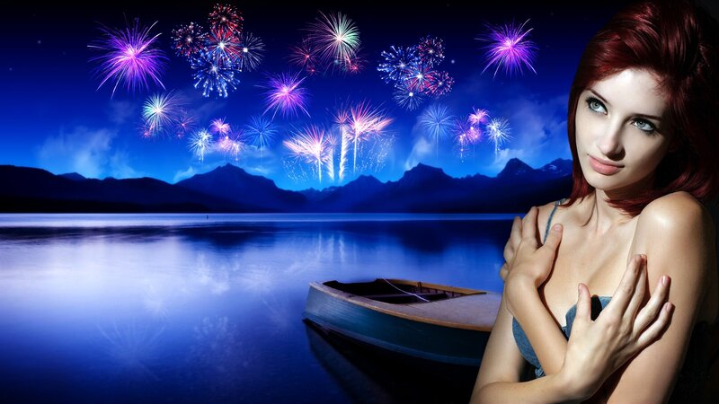 Woman with fireworks over lake