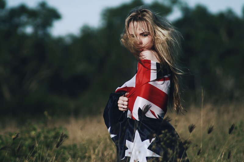 Woman with Flag — Red, Dramatic, Sunset