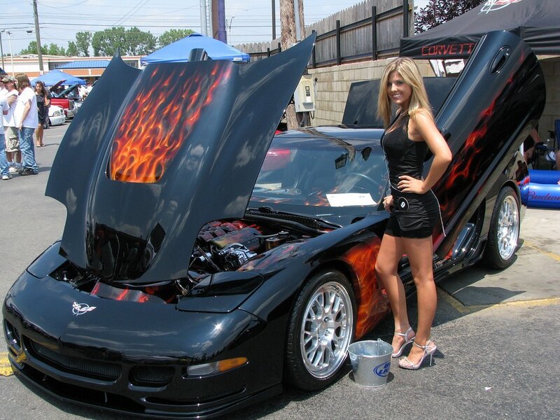 woman with flame-painted corvette