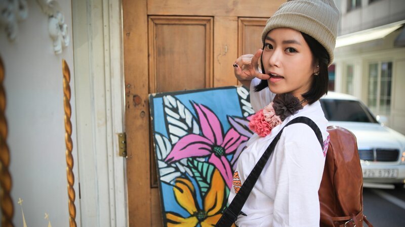 woman with floral art piece