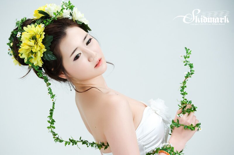 woman with floral crown and vine