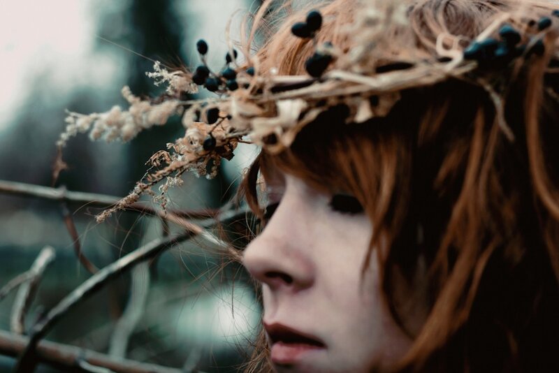 woman with floral crown in forest