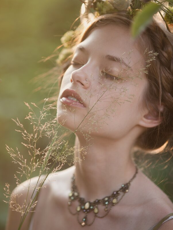 woman with floral crown in sunlight