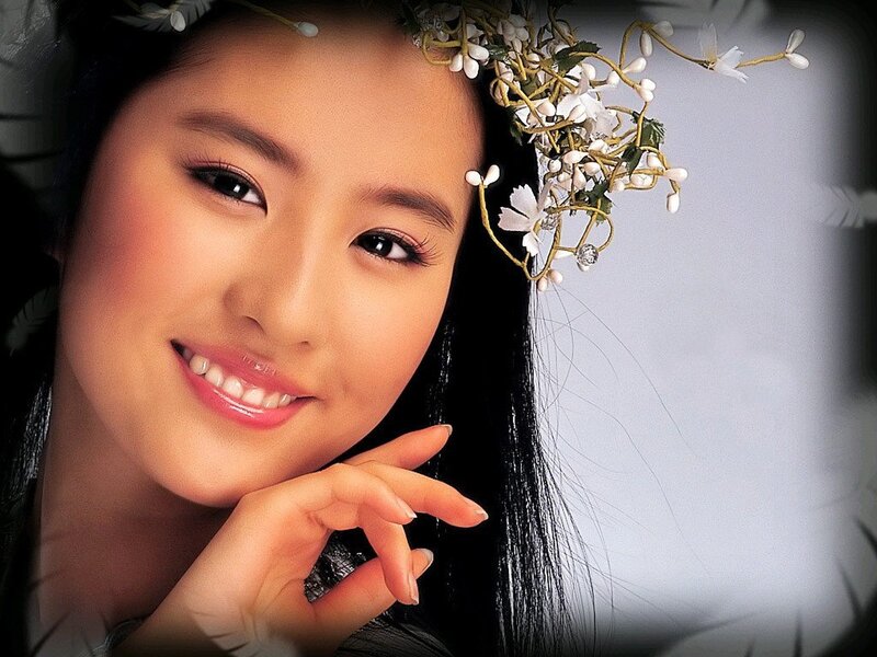 woman with floral crown smiling