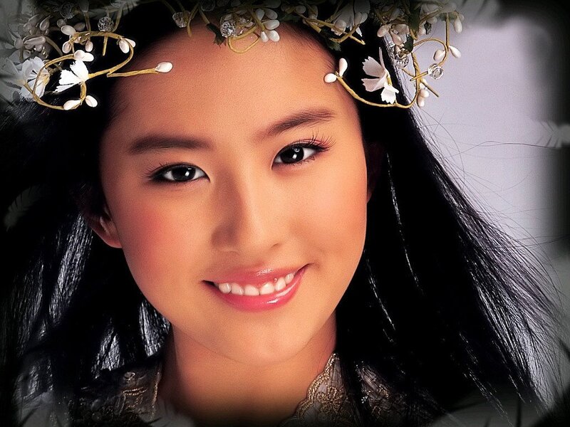 woman with floral crown smiling