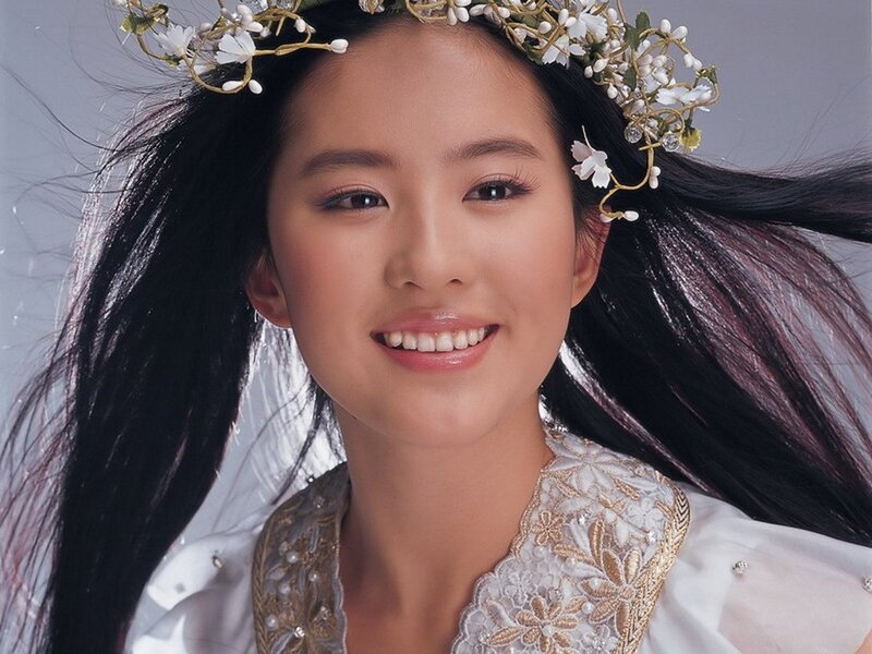 woman with floral crown smiling