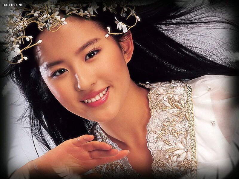 woman with floral crown smiling