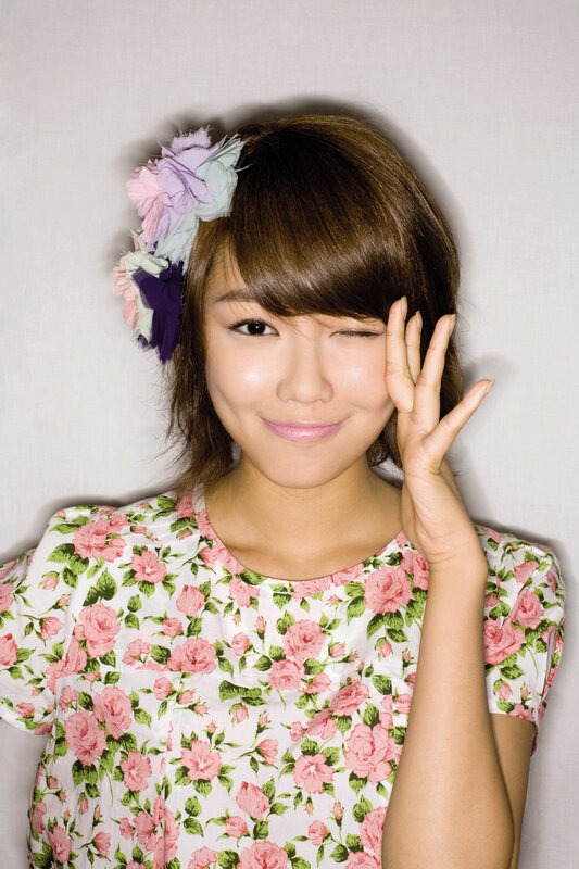 woman with floral dress winking