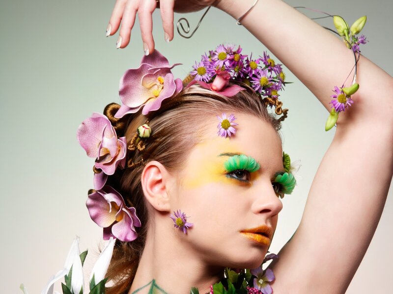 woman with floral makeup and accessories