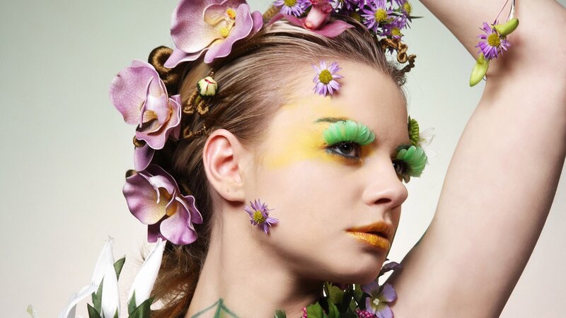 woman with floral makeup and accessories