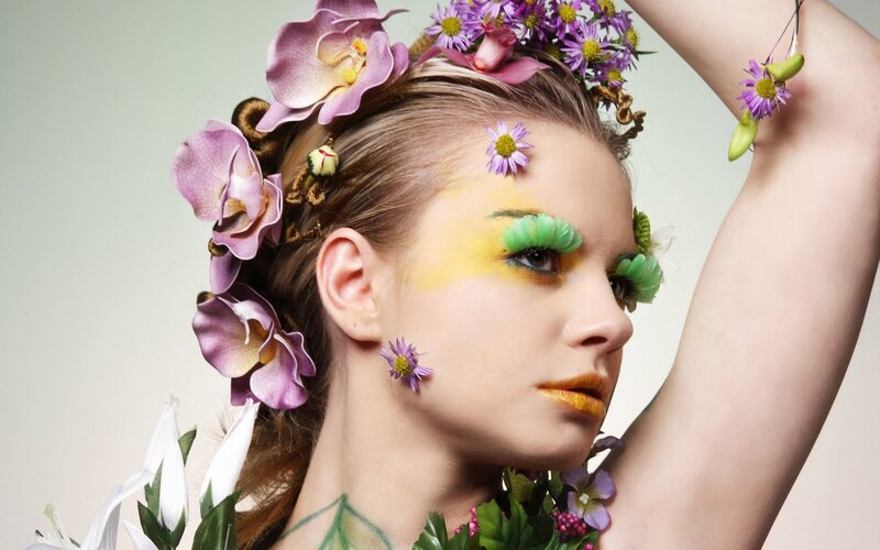 woman with floral makeup and accessories