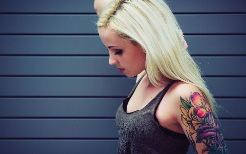 woman with floral tattoo