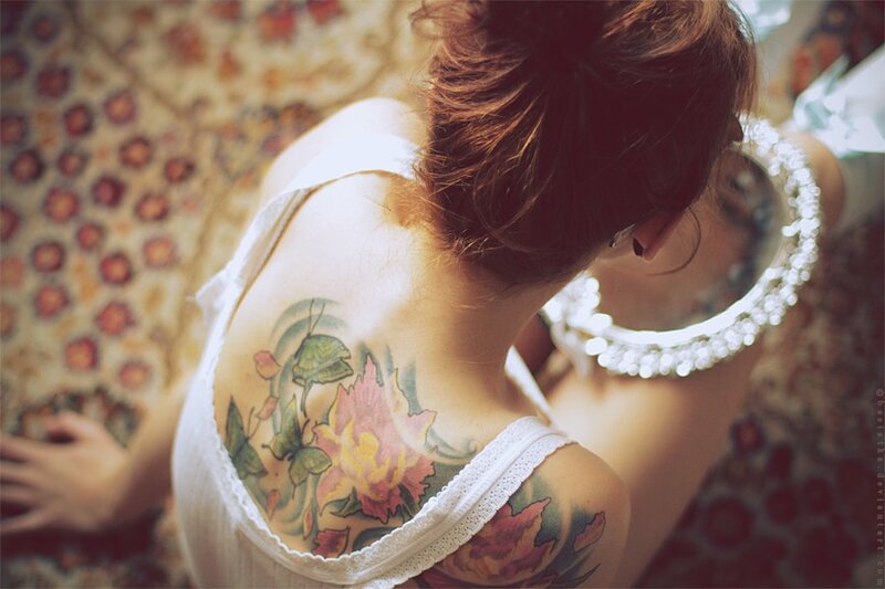 woman with floral tattoo