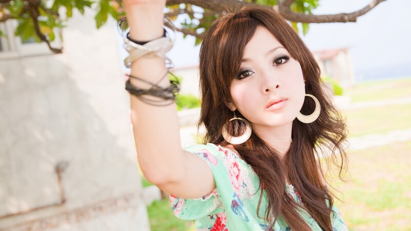 woman with floral top outdoors