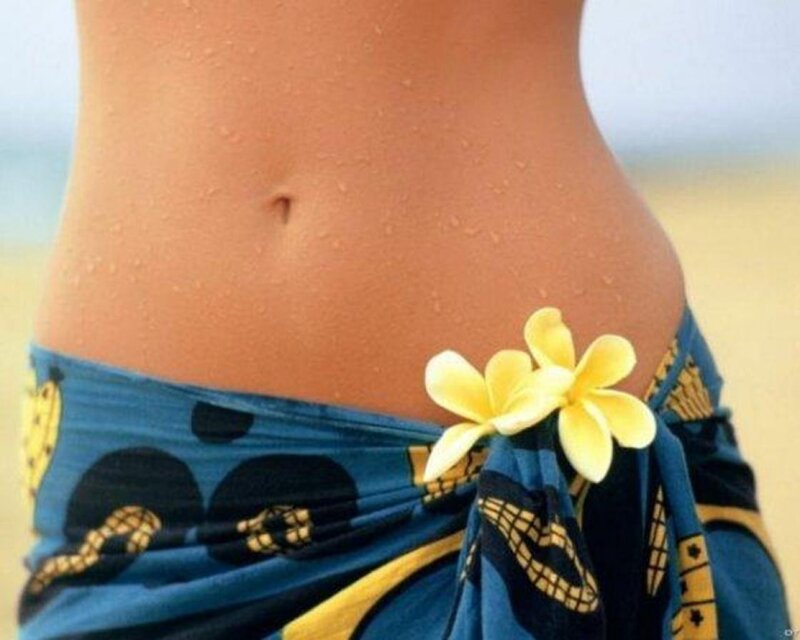 woman with flower at beach