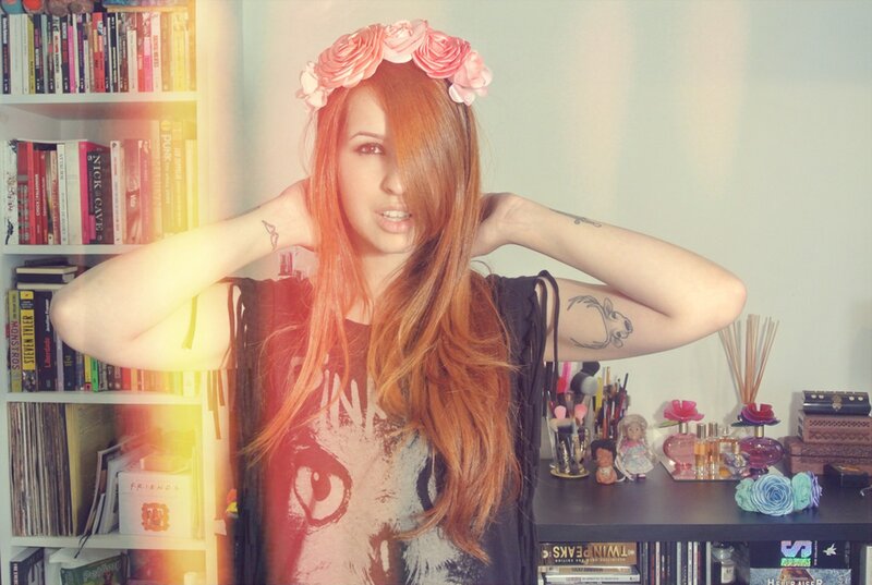 woman with flower crown and tattoos