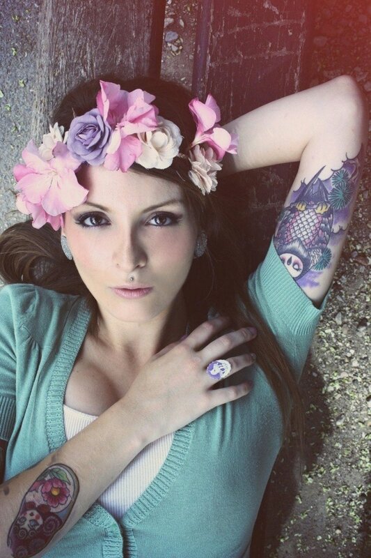 woman with flower crown and tattoos