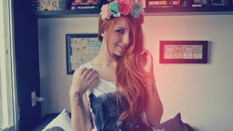 woman with flower crown in bedroom