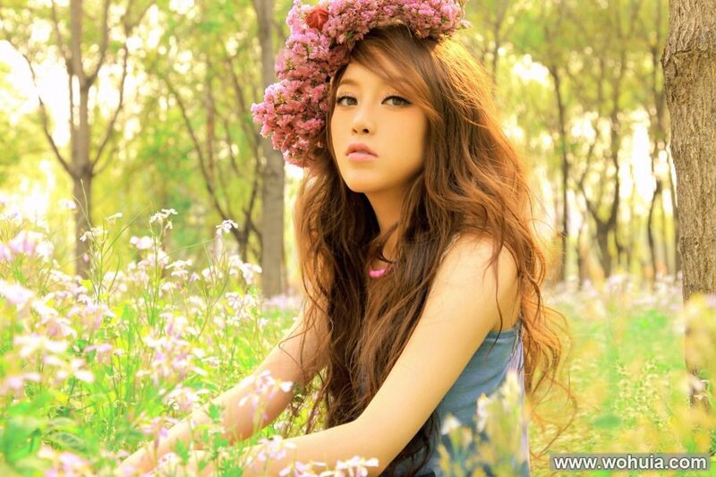 woman with flower crown in field