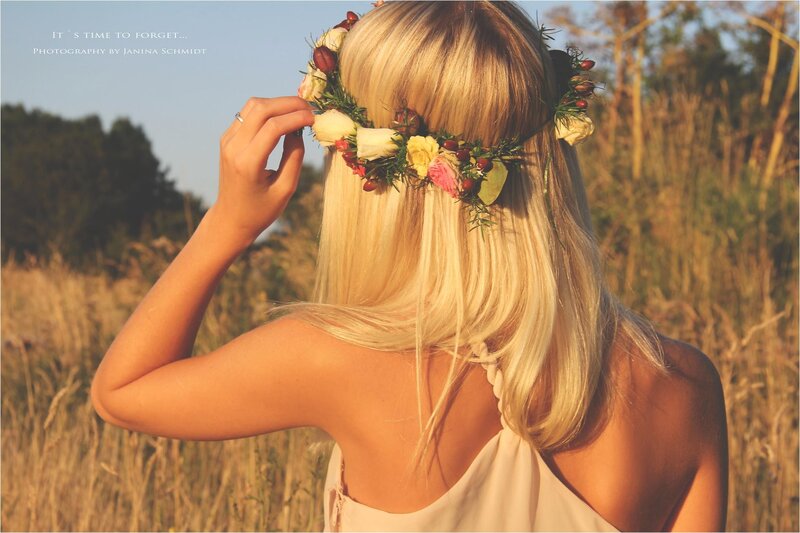 woman with flower crown in field