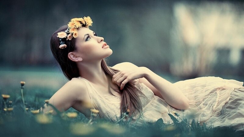 woman with flower crown in field