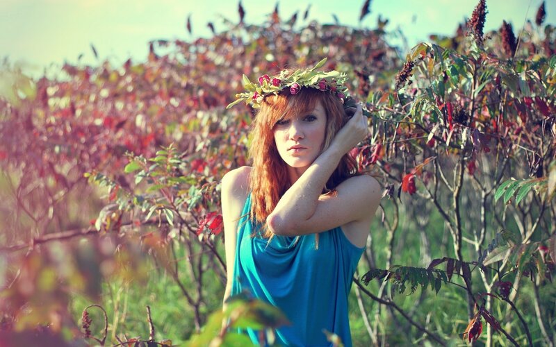 woman with flower crown in field